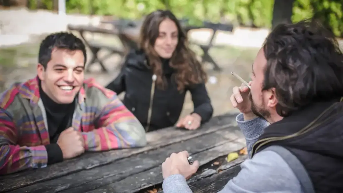 Man smoking with friends