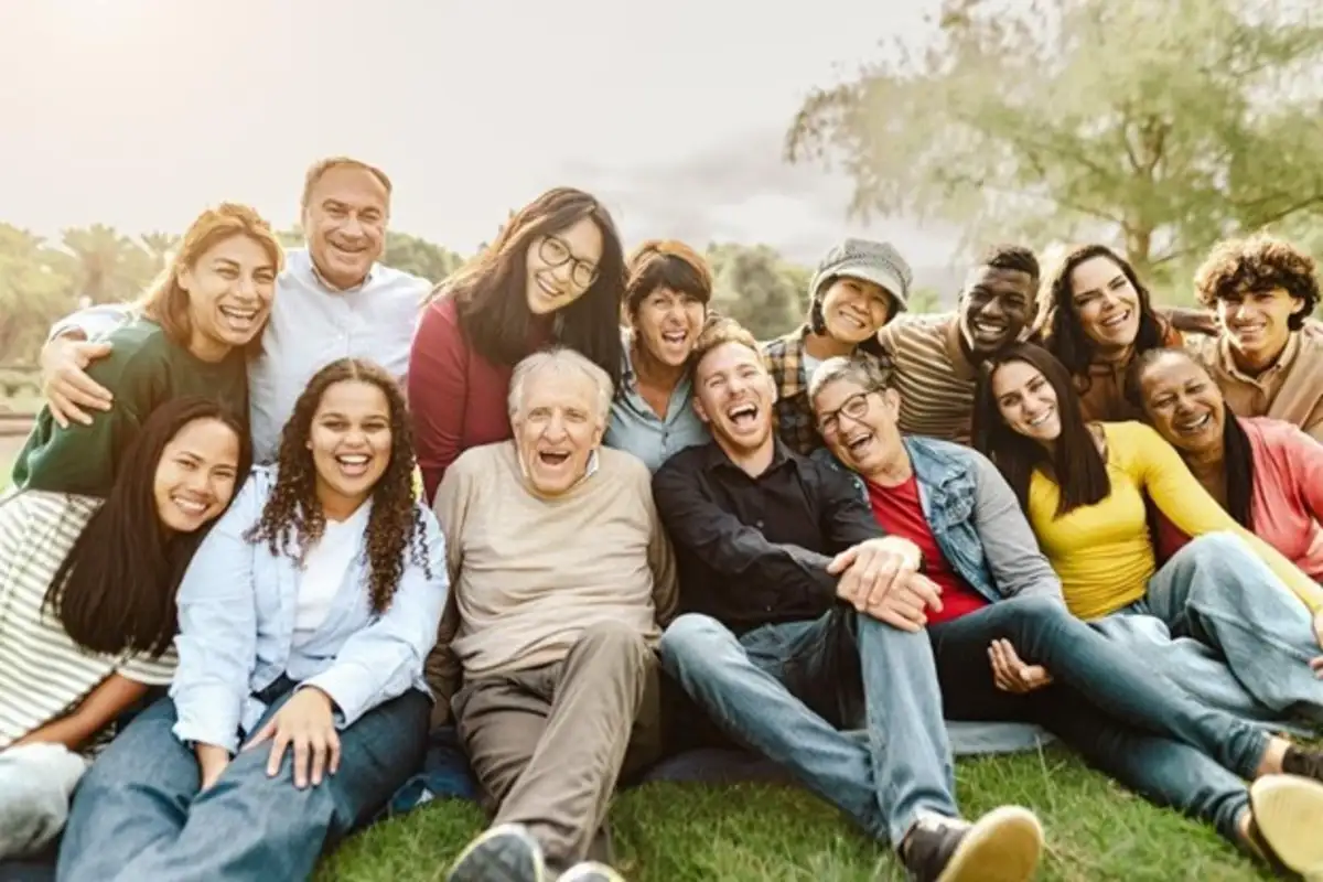 Group of people sitting on grass