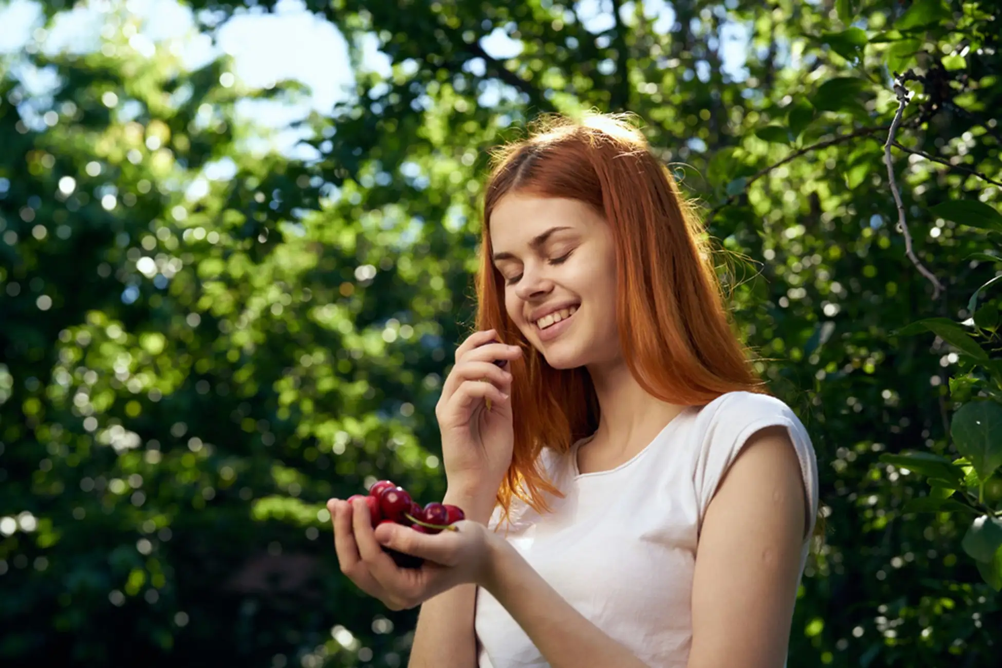 Woman eating cherry