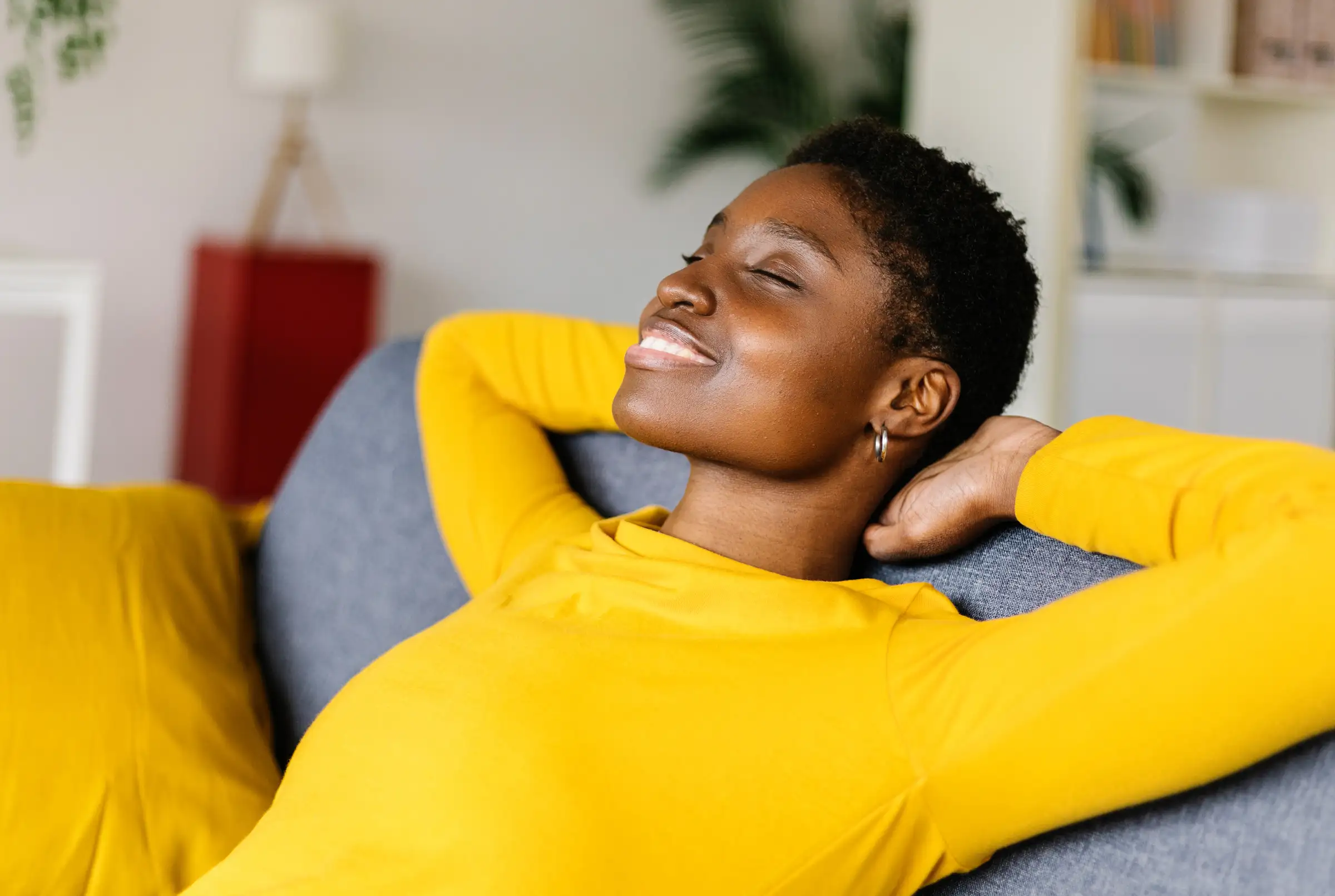 Young african american woman relaxing on a sofa