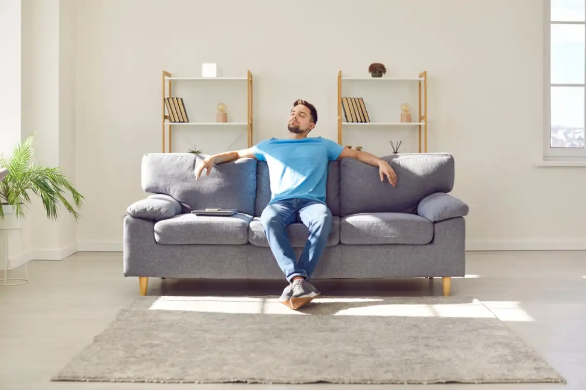 Young man relaxing on couch